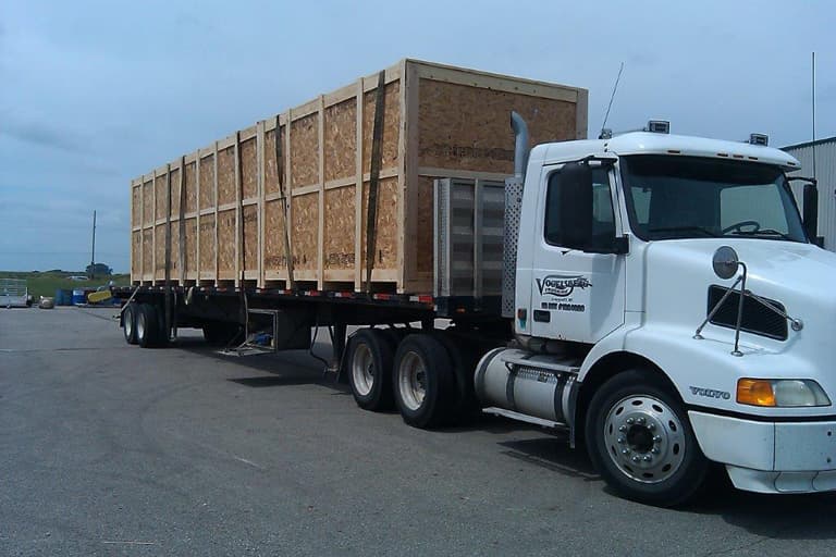 A large crate loaded onto a semi truck